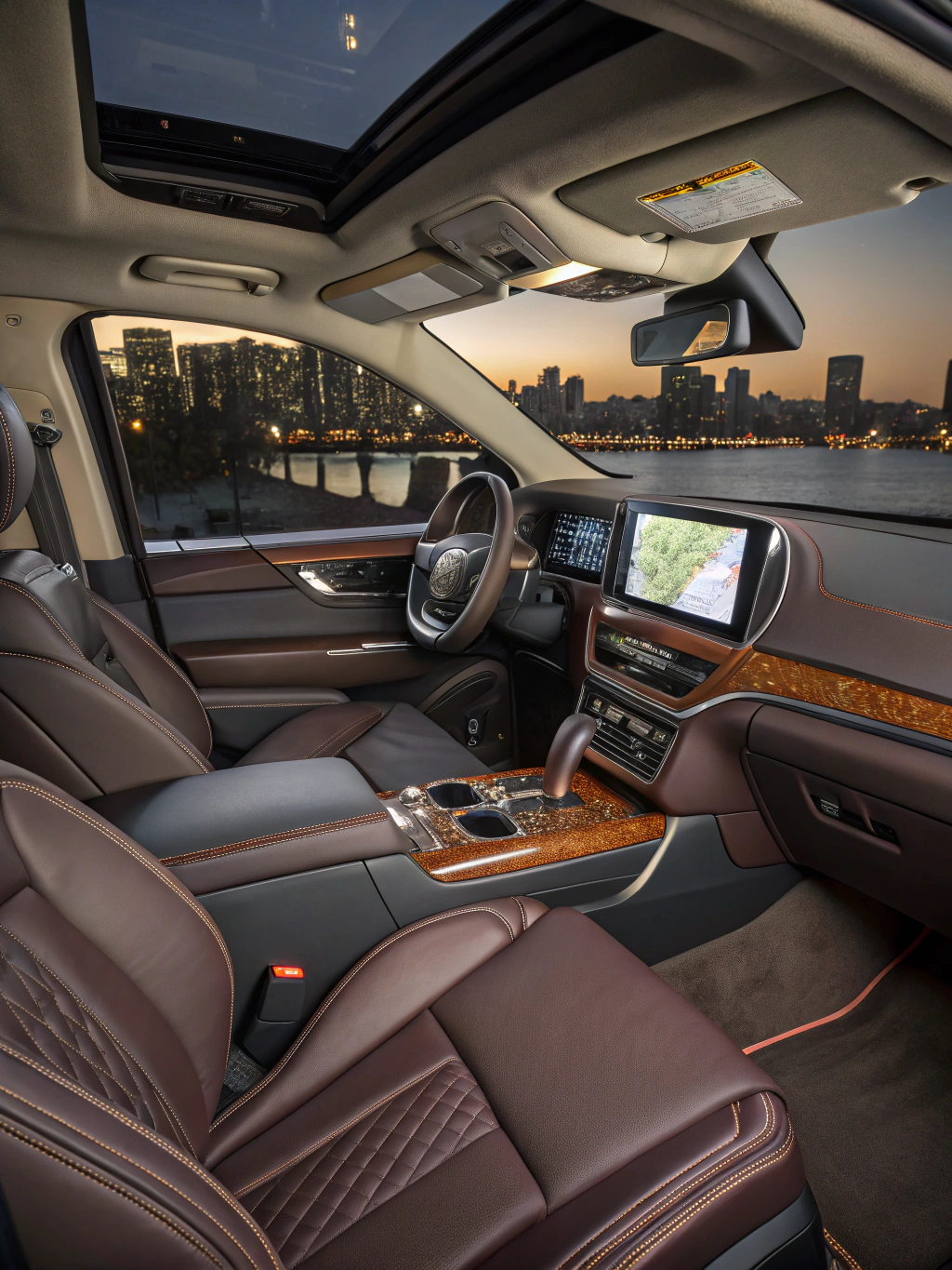 Interior of a luxury sedan cabin showing premium leather and ambient lighting